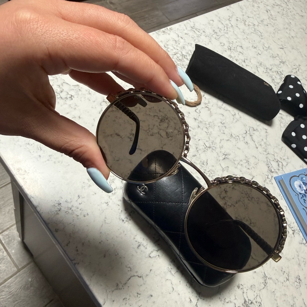 CHANEL Round Sunglasses with Black and Gold Accents